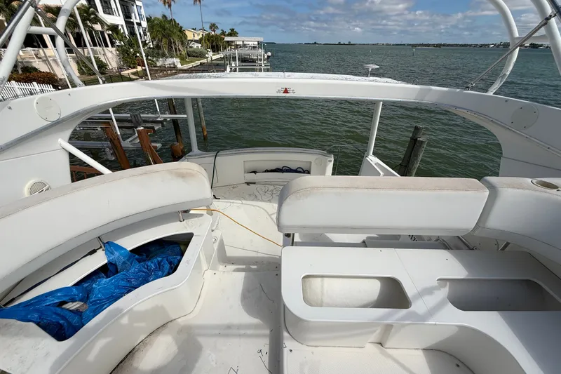 Slide: The Image of 2004 Silverton 43 Motor Yacht deck overlooking serene waterfront view. - 70