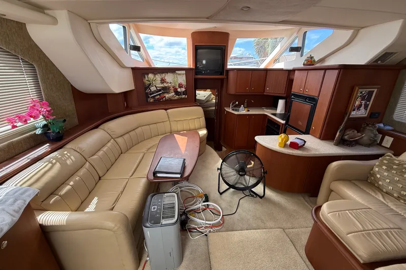 Slide: The Image of Luxurious interior of a 2004 Silverton 43 Motor Yacht with elegant seating and modern amenities. - 87