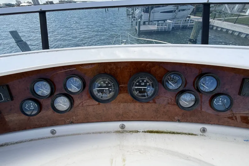 Slide: The Image of Dashboard of a 2004 Silverton 43 Motor Yacht with various gauges and dials. - 31