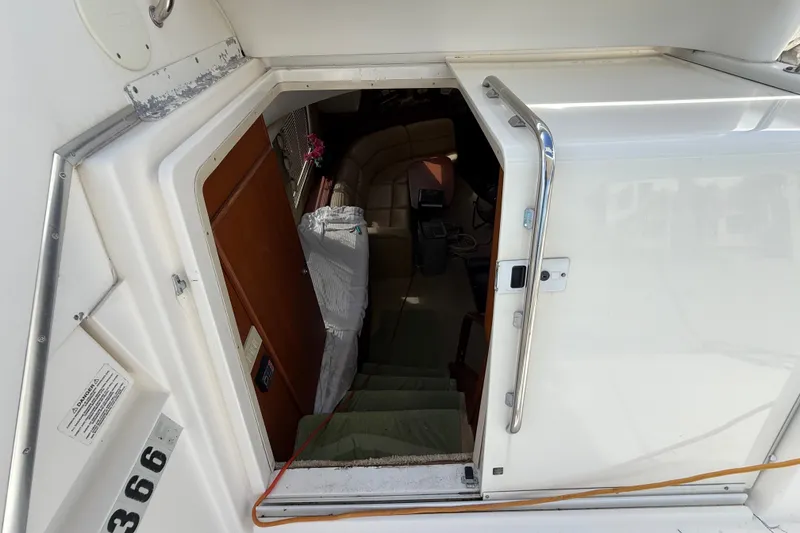 Slide: The Image of Entrance to 2004 Silverton 43 Motor Yacht interior with visible stairs and seating area. - 79