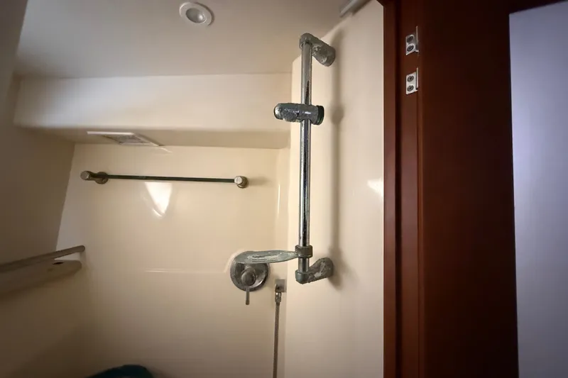 Slide: The Image of 2004 Silverton 43 Motor Yacht bathroom with shower fixtures and towel rack. - 146