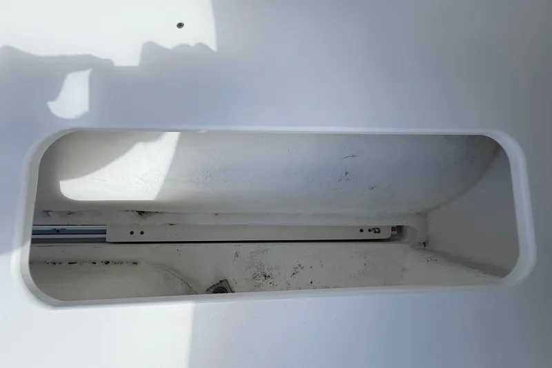 Slide: The Image of Storage compartment on a 2004 Silverton 43 Motor Yacht, showing interior details. - 19