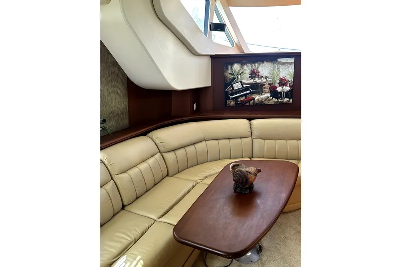 Slide: The Image of Luxurious interior of 2004 Silverton 43 Motor Yacht with elegant seating and artwork. - 4