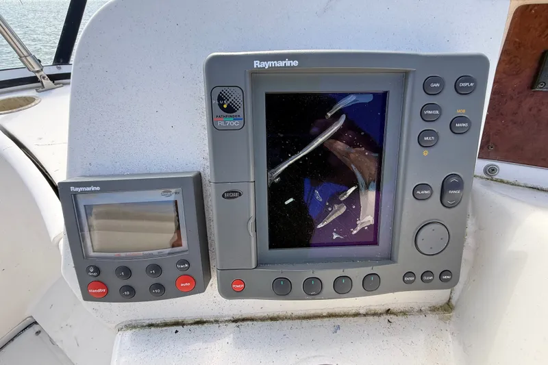 Slide: The Image of Raymarine navigation system on 2004 Silverton 43 Motor Yacht dashboard. - 33