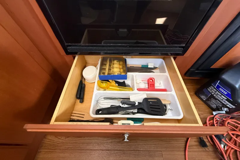 Slide: The Image of Drawer with kitchen utensils in a 2004 Silverton 43 Motor Yacht. - 103