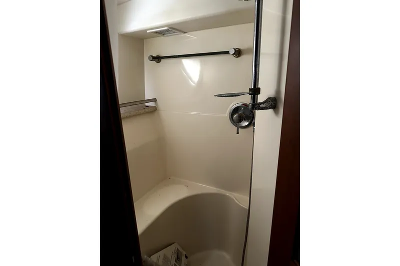Slide: The Image of Shower area in 2004 Silverton 43 Motor Yacht, featuring modern fixtures and compact design. - 25