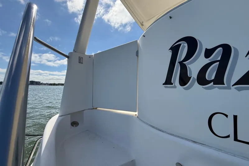 Slide: The Image of 2004 Silverton 43 Motor Yacht deck with partial view of water and sky. - 6