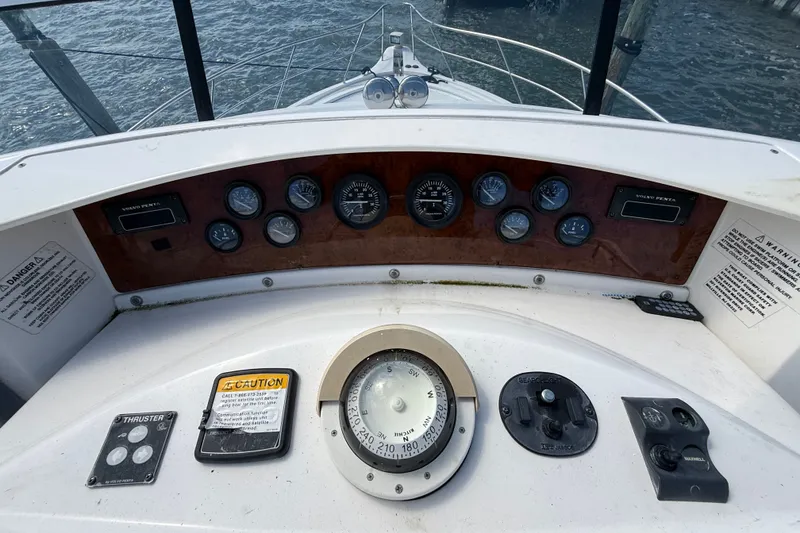 Slide: The Image of 2004 Silverton 43 Motor Yacht helm with gauges and navigation instruments. - 30