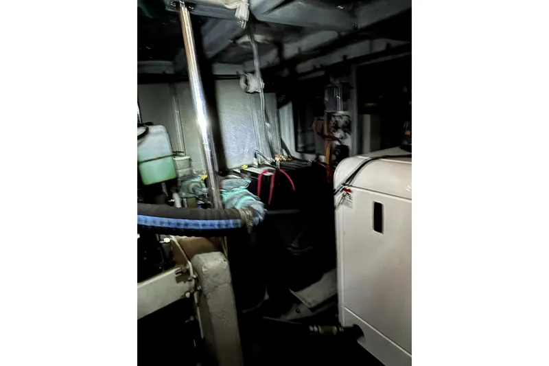 Slide: The Image of Engine room of a 2004 Silverton 43 Motor Yacht, showcasing mechanical components. - 19
