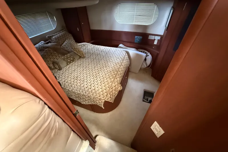 Slide: The Image of Interior cabin of 2004 Silverton 43 Motor Yacht with cozy bed and window blinds. - 139