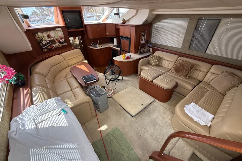 Slide: The Image of Luxurious interior of a 2004 Silverton 43 Motor Yacht with plush seating and modern amenities. - 81