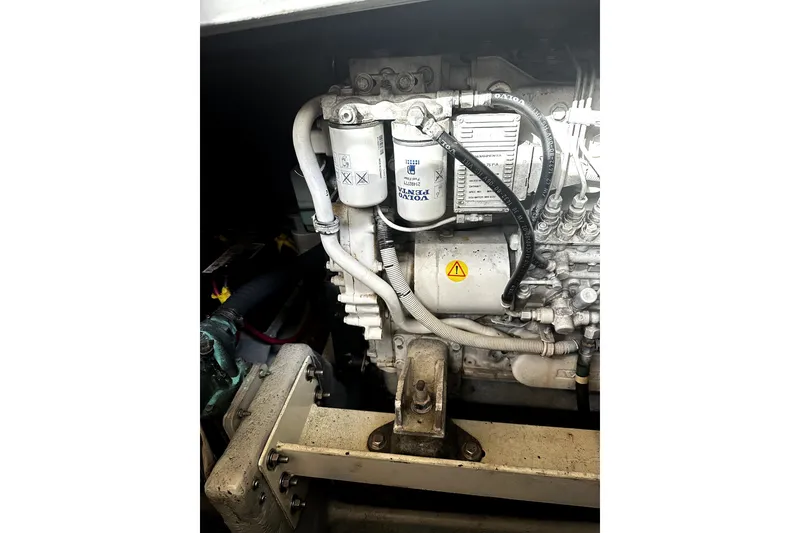Slide: The Image of Engine compartment of a 2004 Silverton 43 Motor Yacht, featuring Volvo Penta components. - 16