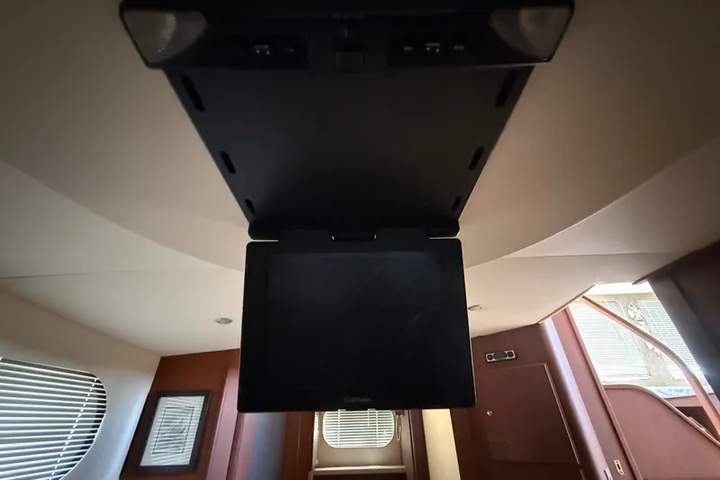 Slide: The Image of Ceiling-mounted TV in 2004 Silverton 43 Motor Yacht interior. - 167