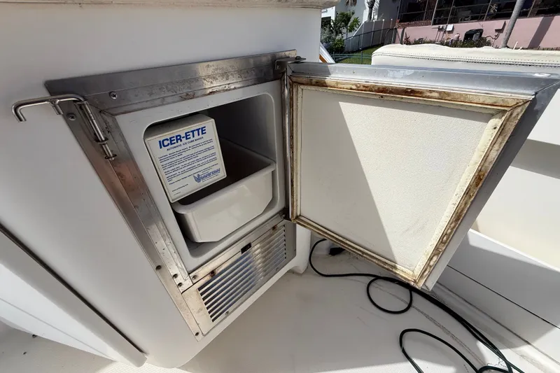 Slide: The Image of Open ice maker on 2004 Silverton 43 Motor Yacht, showing Icer-Ette unit inside. - 13