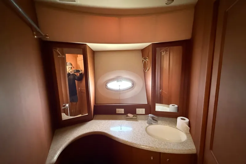 Slide: The Image of Luxurious bathroom interior of 2004 Silverton 43 Motor Yacht with elegant wood finish. - 115
