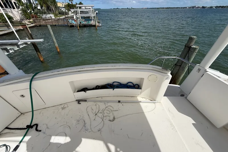 Slide: The Image of 2004 Silverton 43 Motor Yacht deck overlooking serene waterfront view. - 75