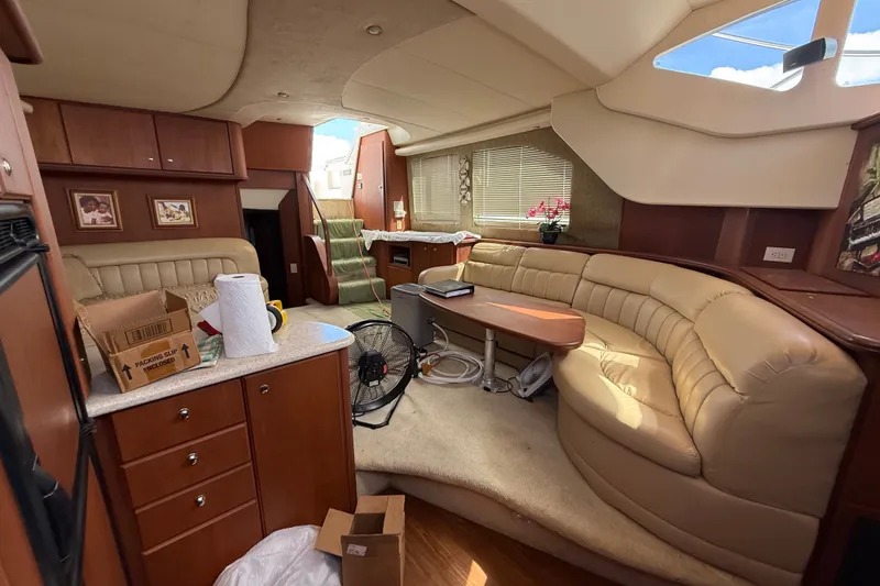 Slide: The Image of Luxurious interior of 2004 Silverton 43 Motor Yacht with plush seating and elegant decor. - 133