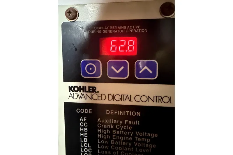 Slide: The Image of Kohler advanced digital control panel displaying 62.8 on a 2004 Silverton 43 Motor Yacht. - 18