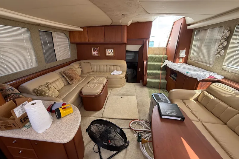 Slide: The Image of Luxurious interior of a 2004 Silverton 43 Motor Yacht with beige leather seating. - 134