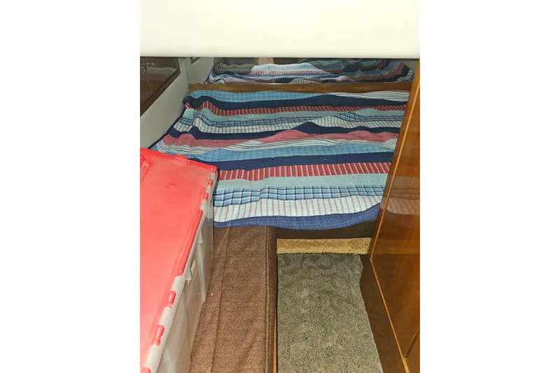 Slide: The Image of Interior cabin of 2001 Carver 564 Cockpit Motor Yacht with colorful bedding. - 18