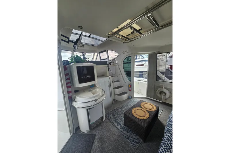 Slide: The Image of Interior of 2001 Carver 564 Cockpit Motor Yacht, featuring modern amenities and stylish design. - 36