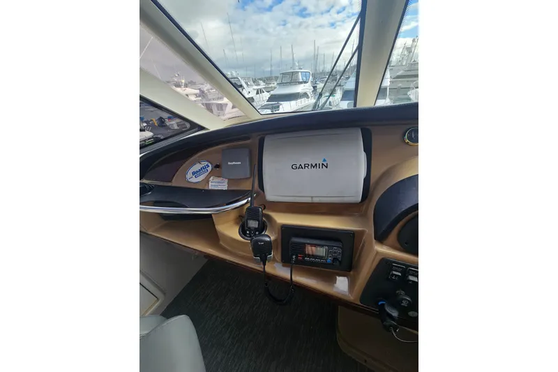 Slide: The Image of Cockpit view of 2001 Carver 564 Cockpit Motor Yacht with Garmin navigation system. - 47