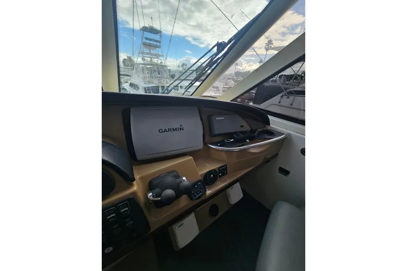 Slide: The Image of Helm of 2001 Carver 564 Cockpit Motor Yacht with Garmin navigation system. - 48