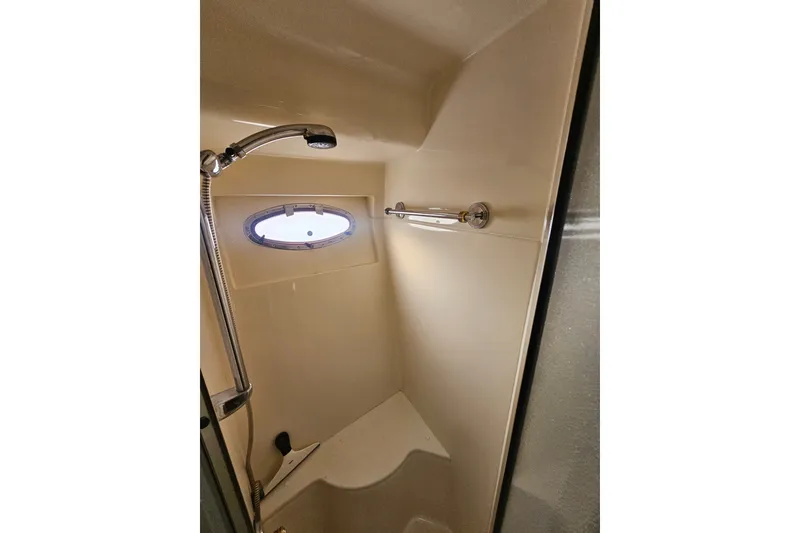 Slide: The Image of Shower area in 2001 Carver 564 Cockpit Motor Yacht with porthole window. - 21
