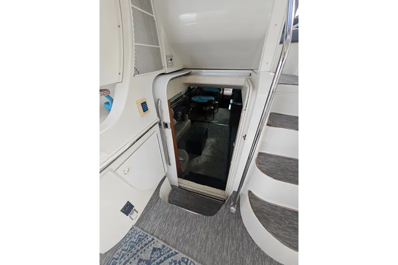 Slide: The Image of Interior view of 2001 Carver 564 Cockpit Motor Yacht with stairs and cabin entrance. - 41