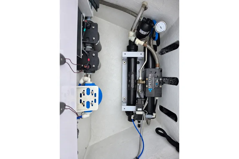 Slide: The Image of Engine compartment of 2022 Axopar 37 XC Cross Cabin with Spectra watermaker system. - 23