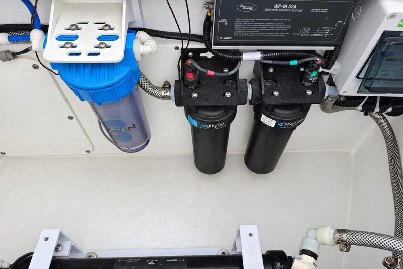 Slide: The Image of Engine compartment of 2022 Axopar 37 XC Cross Cabin with filtration system. - 25