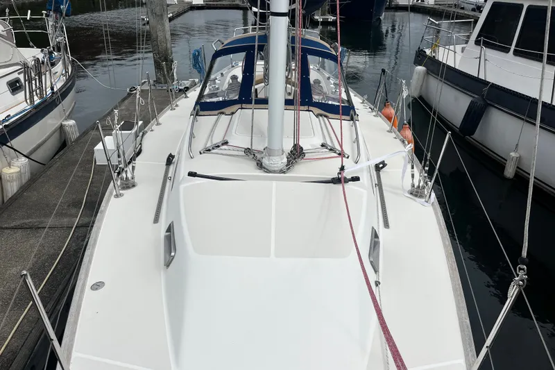 Slide: The Image of 2007 Sabre Spirit sailboat docked at marina, showcasing sleek deck design and rigging. - 20