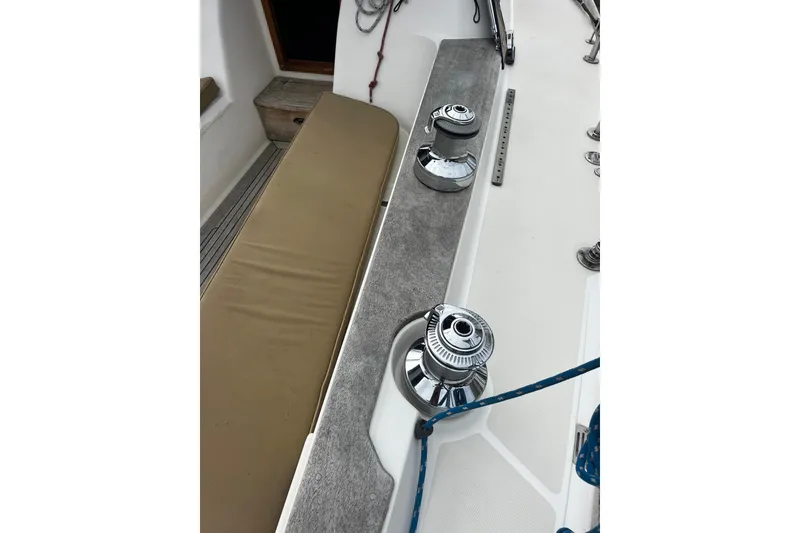 Slide: The Image of 2007 Sabre Spirit sailboat deck with winches and seating area. - 13