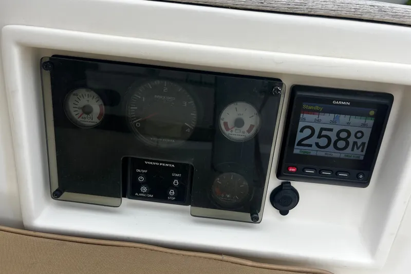 Slide: The Image of Dashboard of a 2007 Sabre Spirit boat with Garmin navigation display. - 25