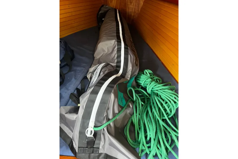 Slide: The Image of Sailing gear inside a 2007 Sabre Spirit, featuring a sail bag and green rope. - 39