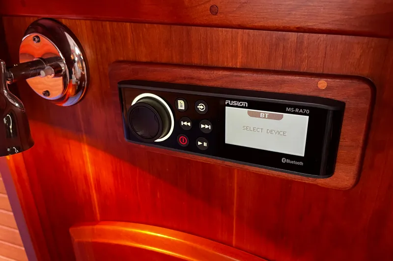 Slide: The Image of Fusion MS-RA70 Bluetooth stereo on 2007 Sabre Spirit boat's wooden interior. - 37