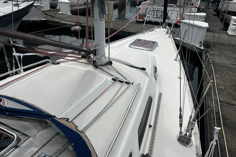 Slide: The Image of 2007 Sabre Spirit sailboat docked, showcasing deck and rigging details. - 19