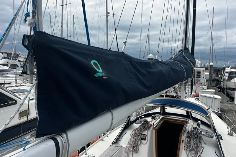 Slide: The Image of 2007 Sabre Spirit sailboat docked at marina with covered boom and rigging. - 21