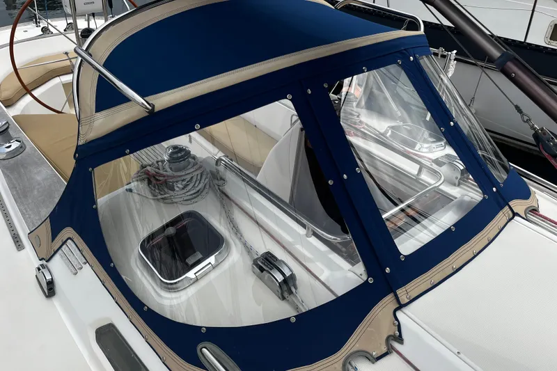 Slide: The Image of 2007 Sabre Spirit sailboat cockpit with blue canvas cover and steering wheel. - 17