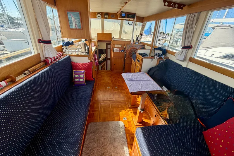 Slide: The Image of Interior of a 1975 Grand Banks 32 Sedan boat with cozy seating and nautical decor. - 8