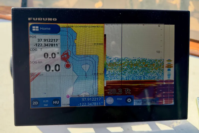 Slide: The Image of Furuno marine GPS display on 1975 Grand Banks 32 Sedan, showing coordinates and depth. - 13