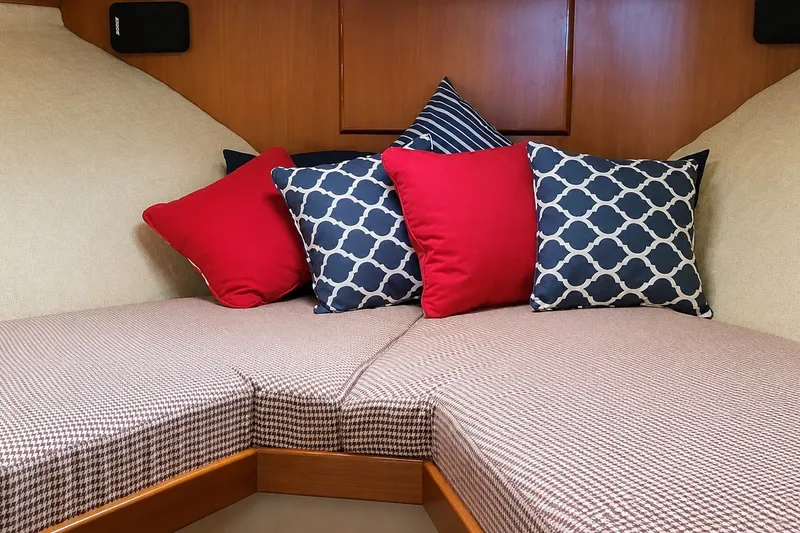 Slide: The Image of Cozy cabin interior of 1981 Bertram 46.6 yacht with patterned cushions and pillows. - 20