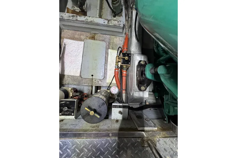 Slide: The Image of Engine compartment of a 1981 Bertram 46.6 yacht, showcasing mechanical components. - 39