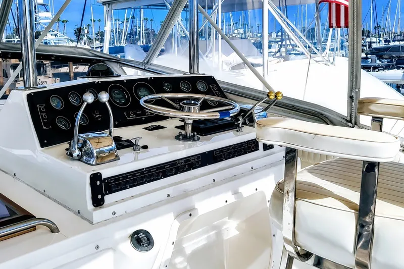 Slide: The Image of Cockpit of a 1981 Bertram 46.6 yacht with steering wheel and control panel. - 3