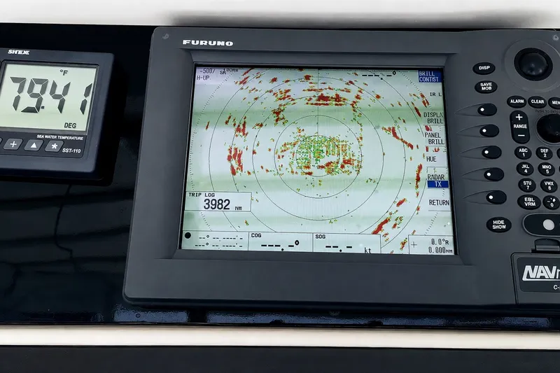 Slide: The Image of Navigation equipment on a 1981 Bertram 46.6 yacht, displaying radar and sea temperature. - 23