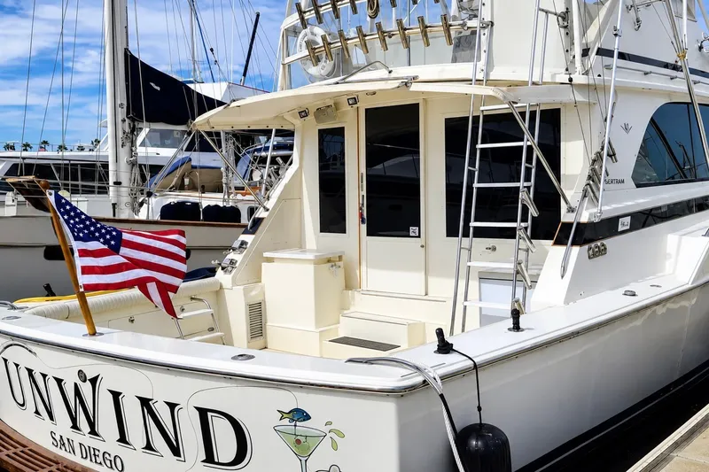 Slide: The Image of 1981 Bertram 46.6 yacht named "Unwind" docked in San Diego marina. - 2