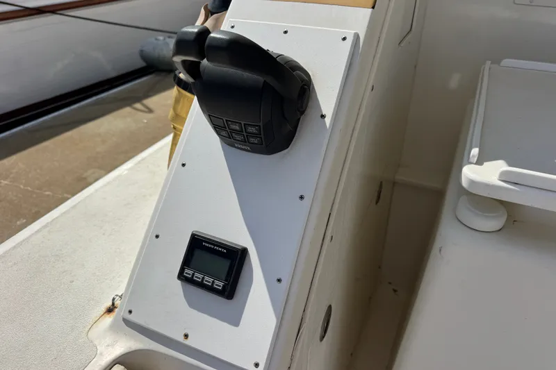 Slide: The Image of Control panel of a 1981 Bertram 46.6 boat with throttle and digital display. - 31