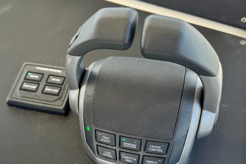 Slide: The Image of Throttle controls on a 1981 Bertram 46.6 yacht, featuring Volvo Penta buttons. - 30
