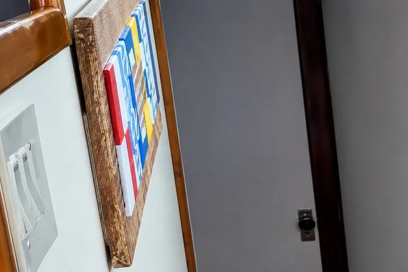 Slide: The Image of Interior of 1981 Bertram 46.6 yacht with colorful wall art and light switches. - 13