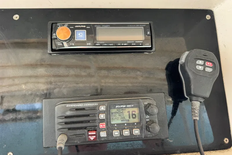 Slide: The Image of Control panel of a 1981 Bertram 46.6 with Alpine and Standard Horizon equipment. - 26